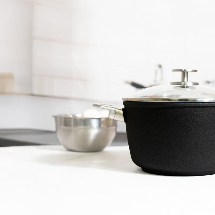 Swiss Diamond CHD ceramic saucepan with glass lid in a bright kitchen